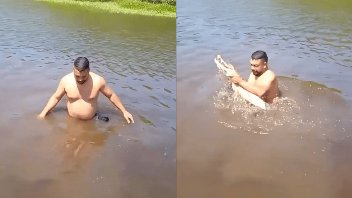 哥倫比亞一男子戲水時突然抱到鱷魚，嚇得急忙逃到船上